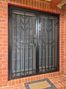 Custom black powder-coated steel security door installed on an Adelaide home by BIC Industries